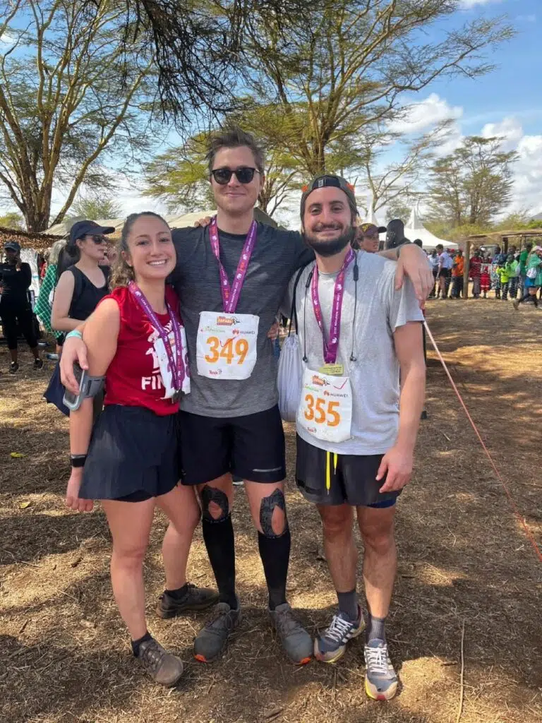 Johannes Borchert with friends, John DiGiacomo (right) and Giordana Lucente (left) after completing the 2022 Lewa half marathon