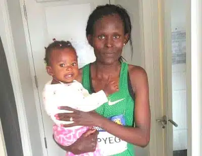 Sally Kipyego with daughter, Emma after BAA 10K